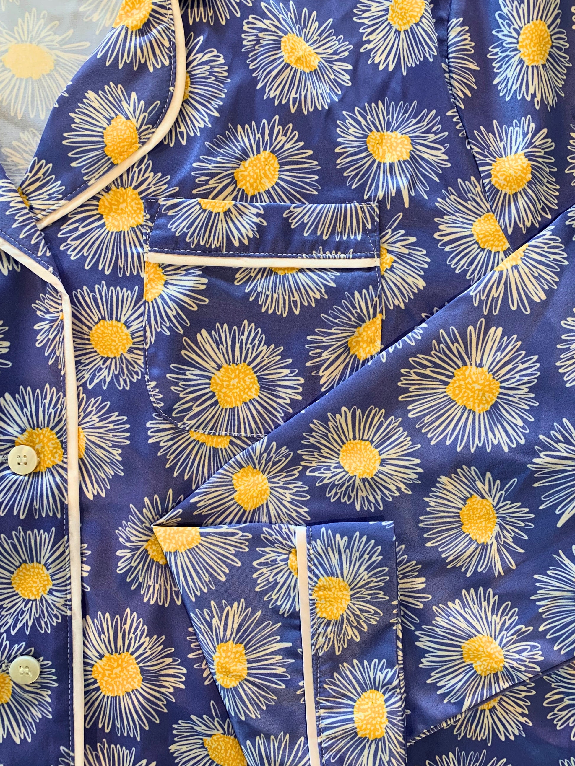 Closeup of Blue Daisy print on Satin Pajama's